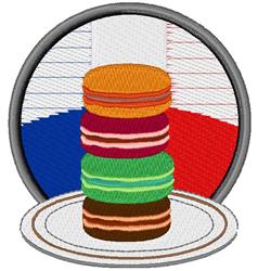 Colorful stack of four macarons on a white plate, featuring orange, pink, green, and brown hues. Playful red, white, and blue
