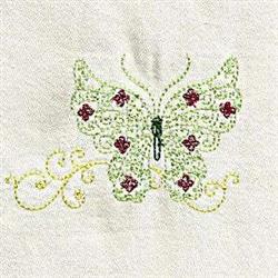 Delicate butterfly with intricate green embroidery, vibrant red accents, and swirling scrolls on a pale background.