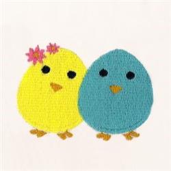 Playful yellow and blue chicks among flowers, perfect for spring, captured in a colorful embroidery design.