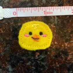 FSL chick decoration in yellow with rounded shapes, cute facial features, and a joyful expression for Easter.