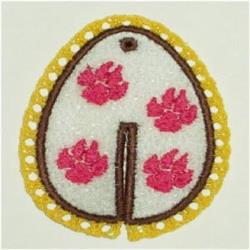 FSL decorative egg design featuring pink flowers and a yellow dotted border on a white background, perfect for Easter.