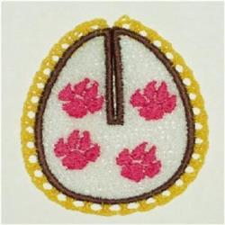 FSL decorative egg with a white background, adorned with pink flowers and yellow lace, perfect for Easter.