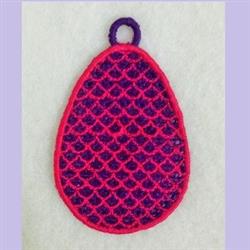 FSL decorative egg shape with vibrant scalloped pattern in purple and pink, perfect for colorful Easter decor.