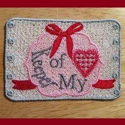 FSL embroidery patch featuring a pink heart, red ribbon bow, and 'Keep of My' text, perfect for Valentine's Day.