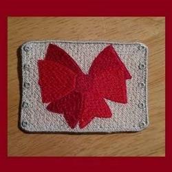 FSL red bow design with vibrant layers on a textured beige background, adorned with decorative borders.