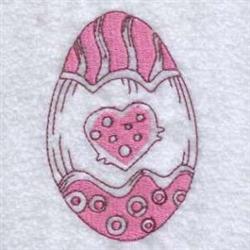 Decorative egg with polka dots and a heart motif, featuring pink and white shades, perfect for Easter celebrations.