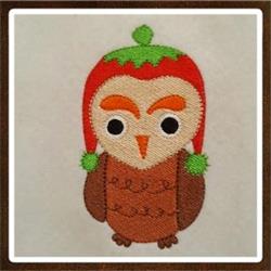 Whimsical owl in a festive red hat with green leaf details, in vibrant fall colors, perfect for autumn decorations.