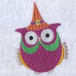 Whimsical owl with a purple body, orange witch's hat, and green eyebrows, perfect for Halloween decor.