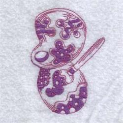 Purple Easter egg with playful patterns, accompanied by a paintbrush, perfect for festive crafts.