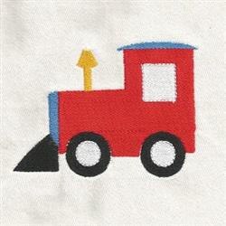 Playful red train with yellow arrow and black tire on light fabric, ideal for children's decor.