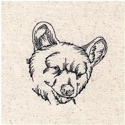 Redwork bear head in simple line art, featuring black thread on neutral fabric with expressive details.