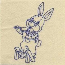Redwork bunny in overalls with a tool, standing on a wooden frame, outlined in blue against a light cream background.