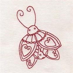 Redwork butterfly with heart-shaped wings and a smiling face, outlined in red thread on light fabric.