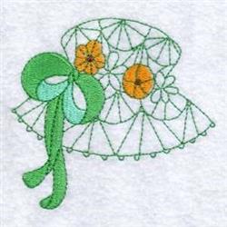 Redwork hat with vibrant orange flowers and a green ribbon, adorned with whimsical white stitching for spring.