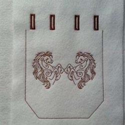 Redwork horses facing each other, with detailed manes and bodies, surrounded by curvilinear motifs in reddish-brown stitching