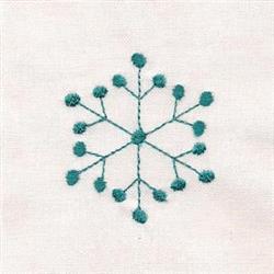 Redwork snowflake in teal color with delicate stitch details, set against a light background, perfect for winter themes.