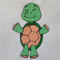 Applique turtle with a smiling face, light green body, and vibrant orange shell pattern, perfect for children.