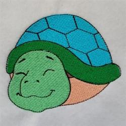 Cartoon turtle with a smiling face, vibrant hexagonal shell in blue and green, set against a white background.