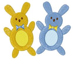 Playful bunny applique in bright yellow and soft blue, each with bow ties, perfect for Easter decor.